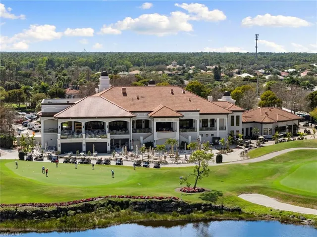 View of home's community with golf course view and a water view