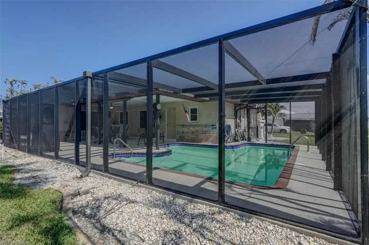 View of pool featuring a lanai and a patio area