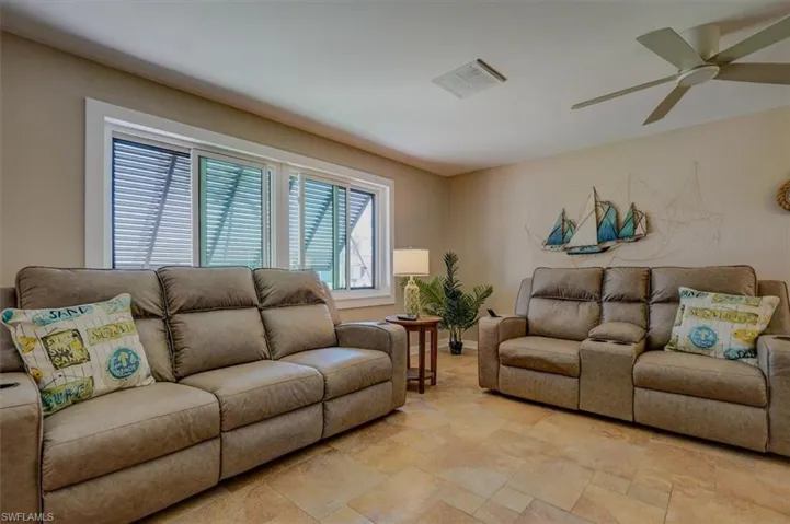 Living room featuring ceiling fan