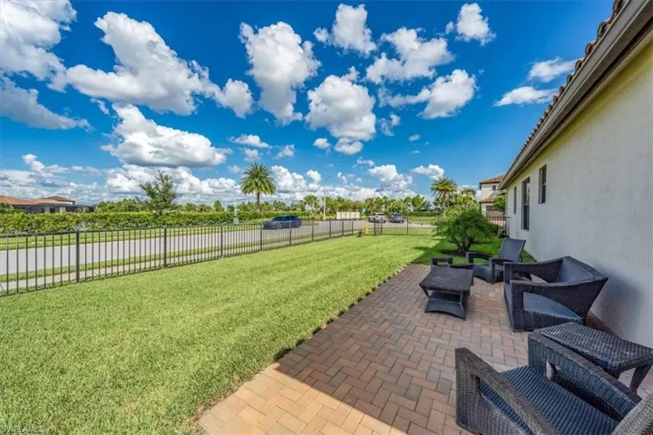 Exterior Fenced Yard / Extended Pavers over looking the Lake