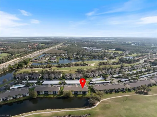 Drone / aerial view featuring a water view, a residential view, and golf course view