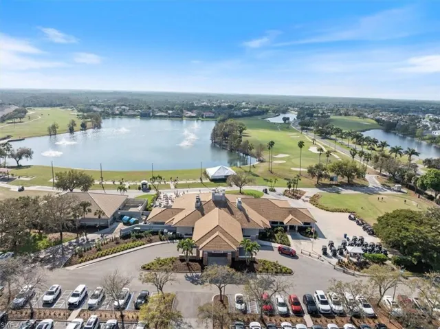 Bird's eye view with a water view and golf course view