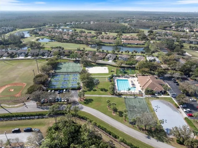 Drone / aerial view with a water view and a residential view