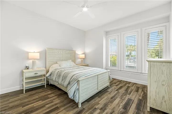 Bedroom featuring dark wood finished floors and ceiling fan