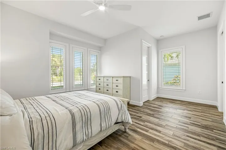 Bedroom featuring wood finished floors and ceiling fan