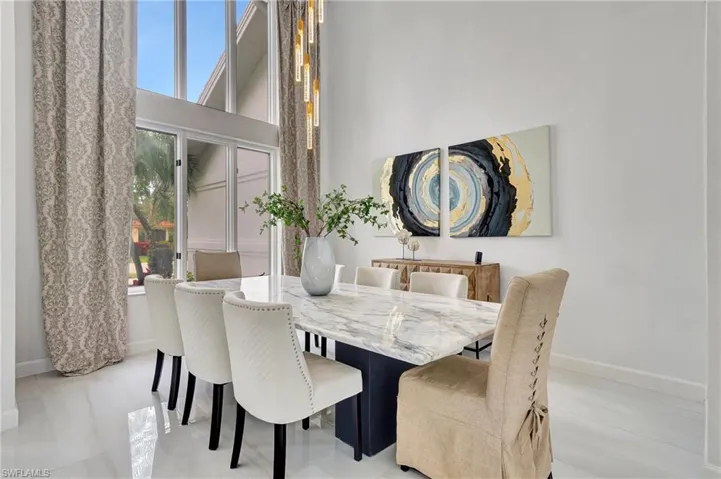 Floor to ceiling windows frame the formal dining room
