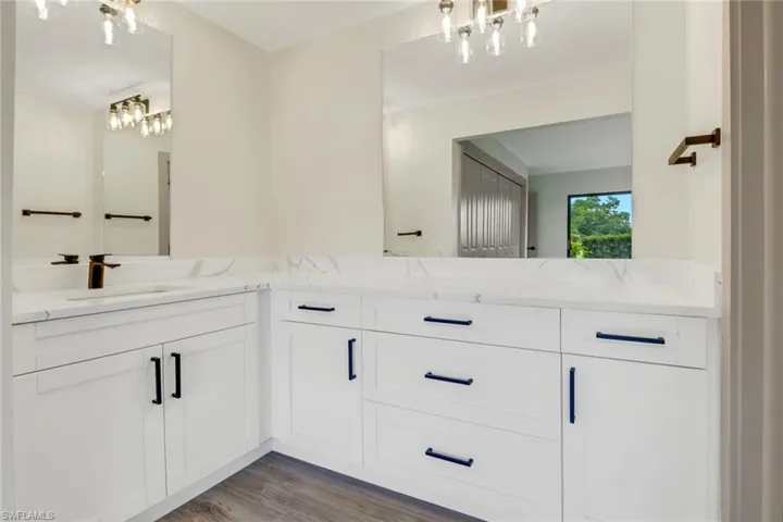 Bathroom with vanity and hardwood / wood-style floors