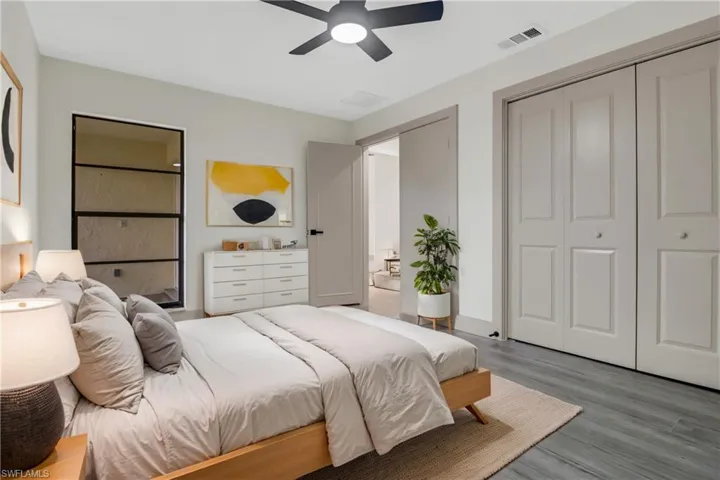 Bedroom with hardwood / wood-style flooring and ceiling fan