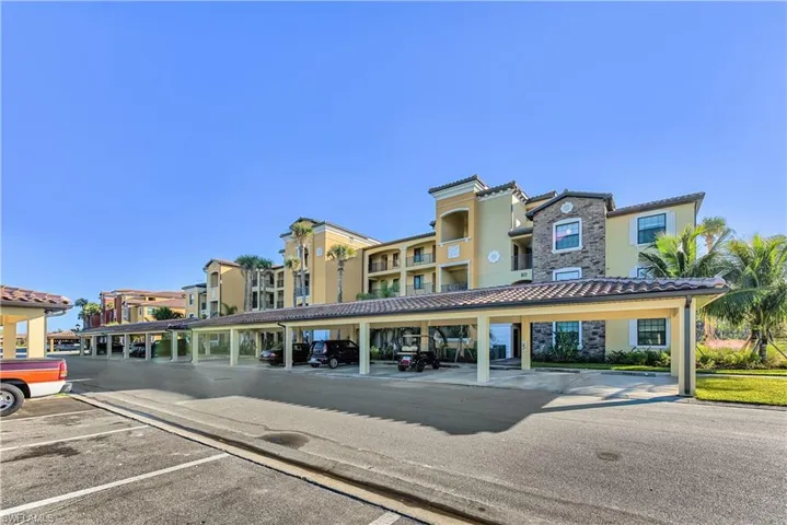 Multi-story residential building with stucco and stone exterior finishes
