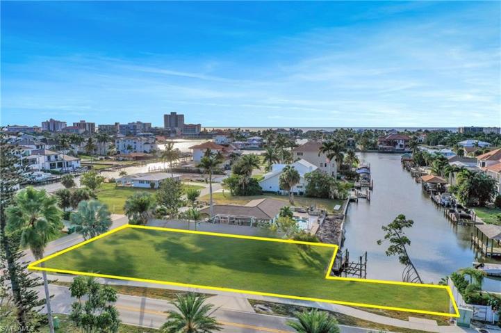 Gulf Access Lot - Photo Virtually Enhanced to show cleared lot - Home is still on the property.Verify to own satisfaction the accuracy of the highlighted lot lines.