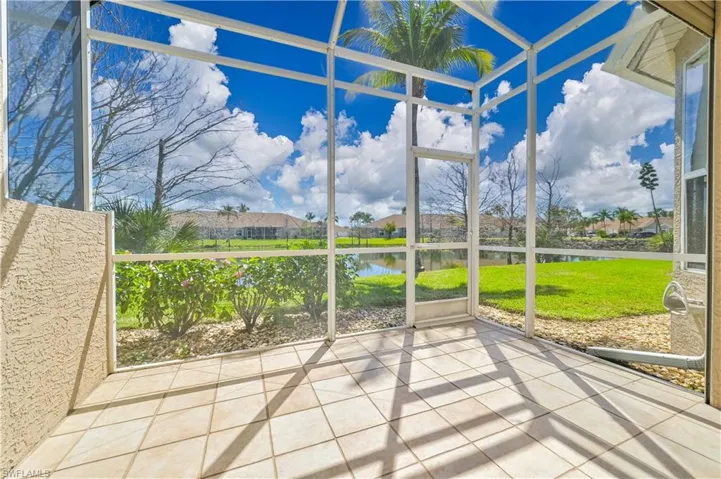 Unfurnished sunroom featuring a water view