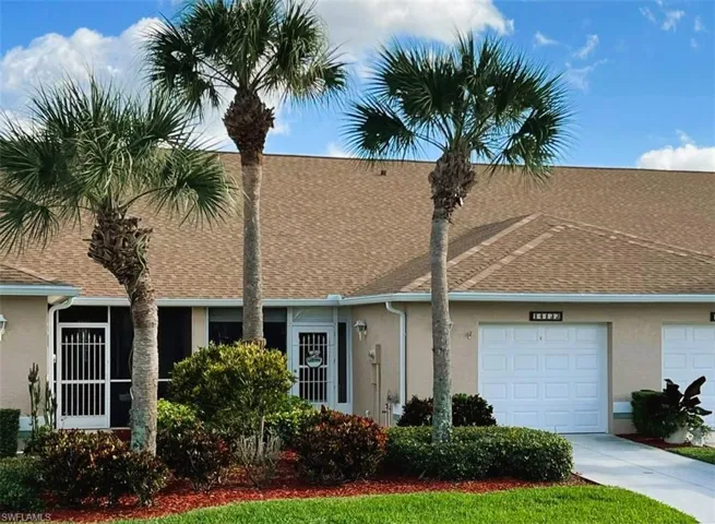 View of front of property with a garage