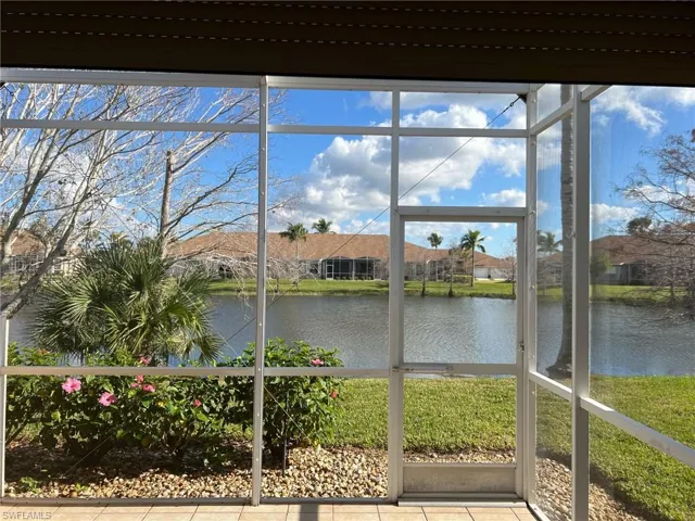 Unfurnished sunroom with a water view