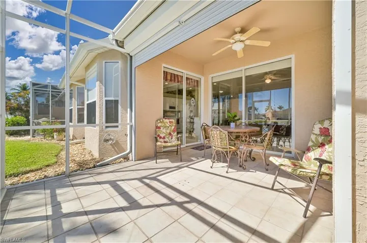 Sunroom / solarium featuring ceiling fan