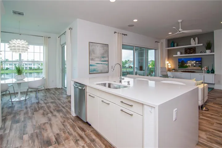 Kitchen looking out to dining nook and great room
