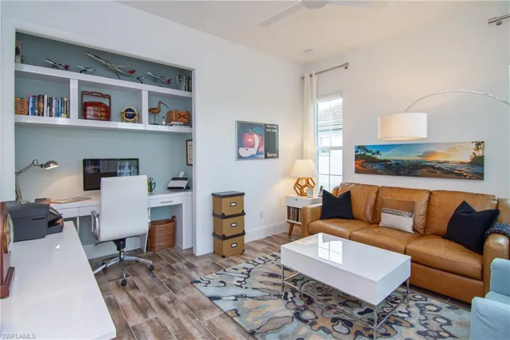 Den/4th bedroom with   built-in workspace.