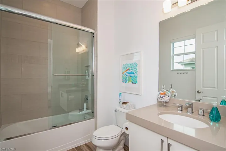Bedroom 3 en-suite bath.  Quartz countertop on floating vanity.