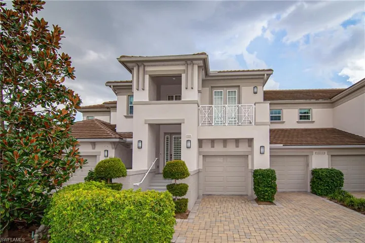 8034 Signature Club Circle Unit 201.  The 2 single garage doors actually open up into one large 2+car garage.  Balcony is accessible from bedroom 2.