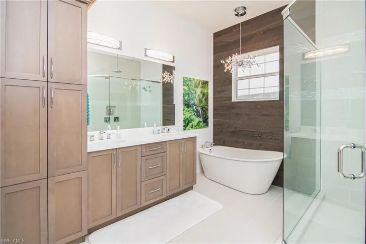 Primary Bath with custom marine wood wall.