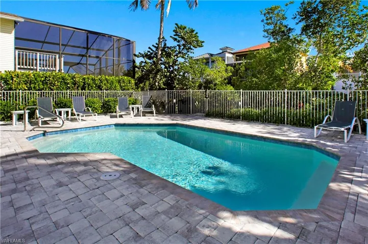 Relaxing and private back yard pool area and dock.