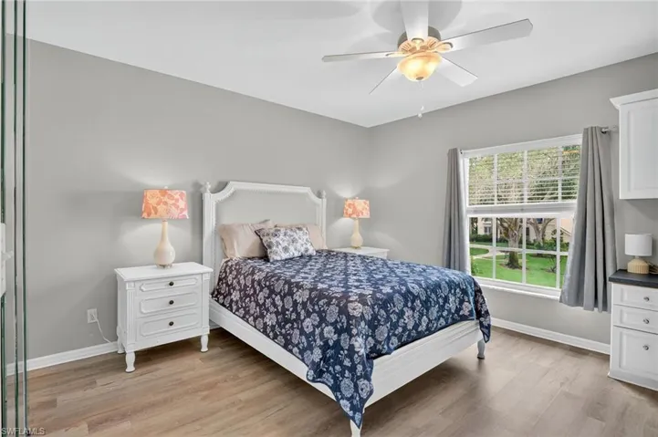 Bedroom with light wood-style flooring and ceiling fan