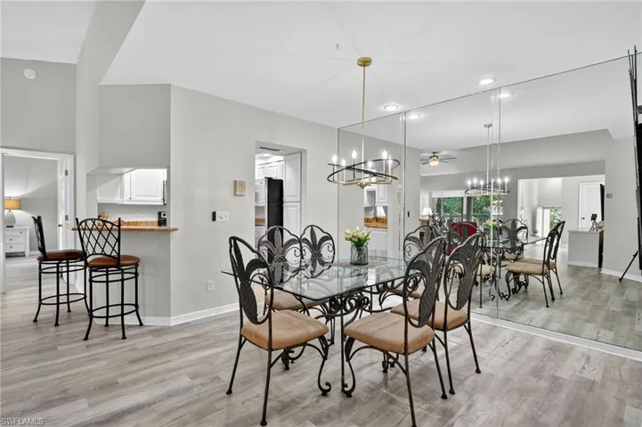 Dining space featuring light wood-type flooring, a chandelier, recessed lighting, and ceiling fan