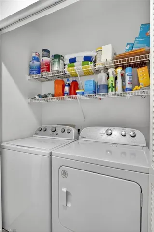 Washroom featuring separate washer and dryer