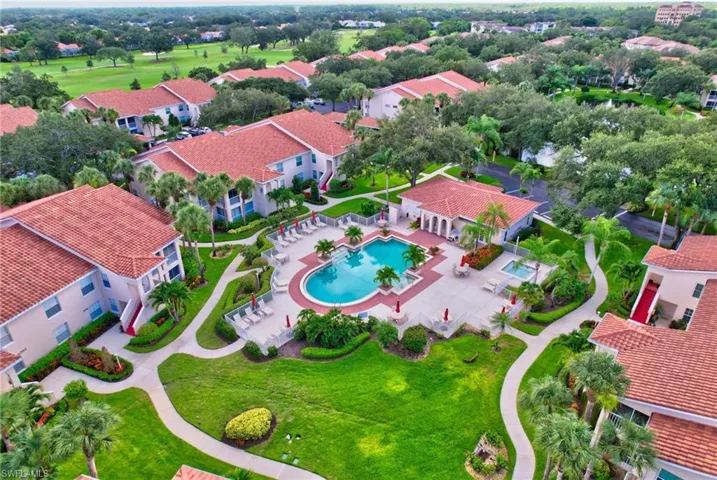 Aerial perspective of suburban area with a pool area
