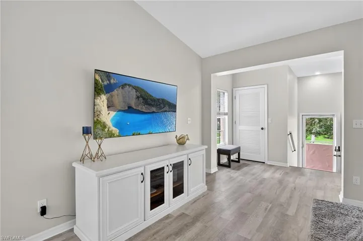 Entrance foyer with light wood-style flooring and baseboards