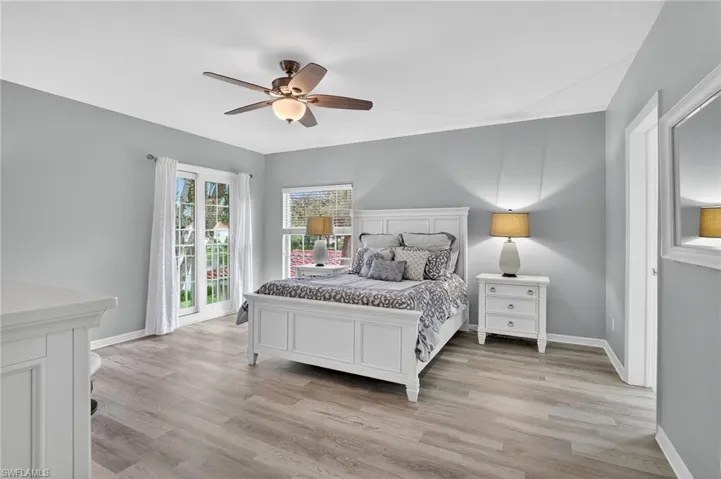 Bedroom with light wood-type flooring and ceiling fan