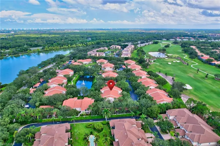 Aerial view of property and surrounding area with nearby suburban area