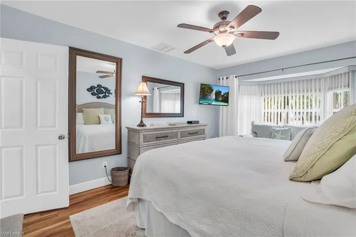 Bedroom featuring light hardwood / wood-style flooring and ceiling fan