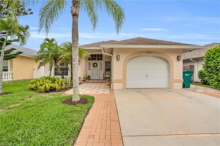 View of front of property with a garage