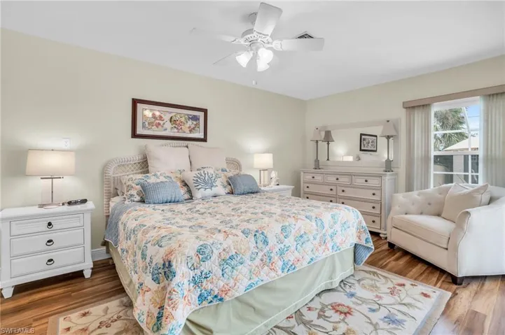Bedroom with wood-type flooring and ceiling fan