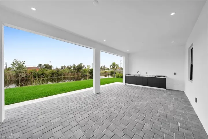 View of patio / terrace with a water view