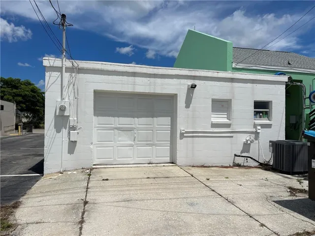 Garage with concrete driveway
