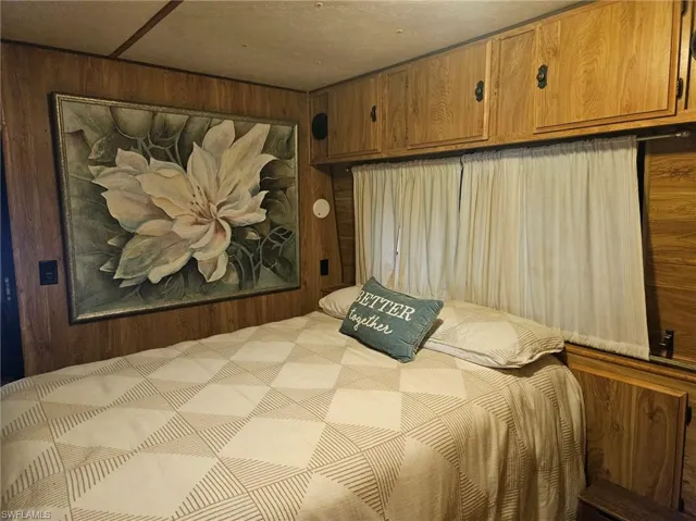 Bedroom with wooden walls