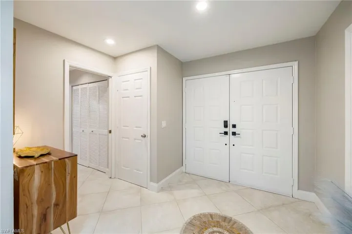 Foyer featuring light tile patterned floors and recessed lighting