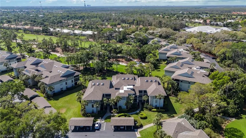 Aerial view of residential area with a local golf course