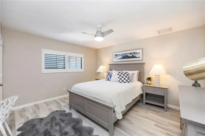 Bedroom with light wood-style flooring and ceiling fan