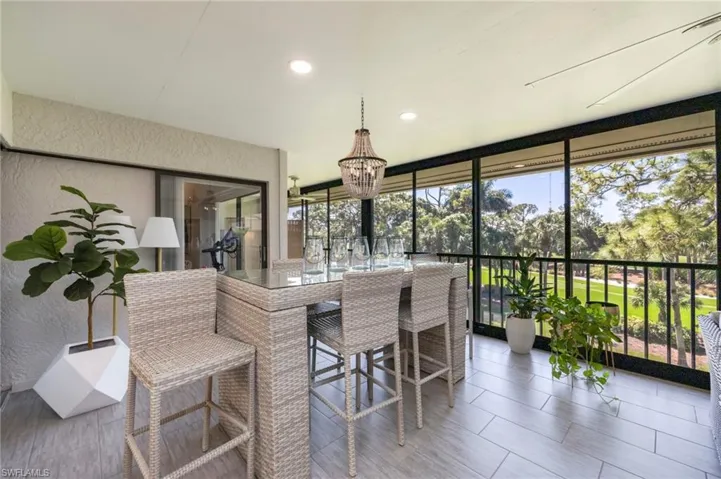 Sunroom / solarium with hanging lights