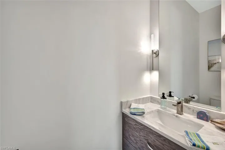 Half bath with vanity and toilet