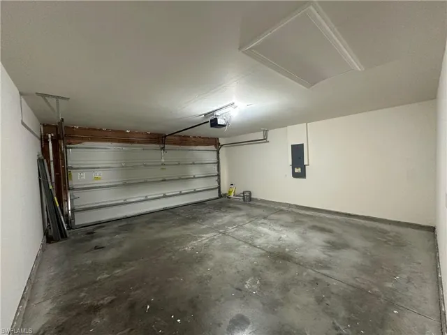 Garage featuring electric panel