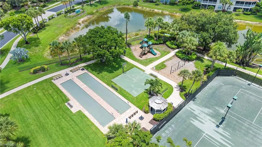 Community recreation area featuring tennis courts, bocce ball courts, a children's playground, and a gazebo