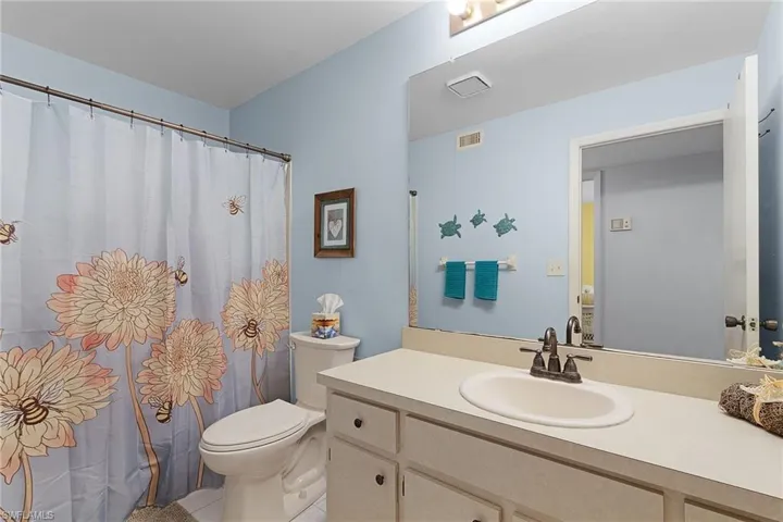 Guest bathroom with comfort height toilet.