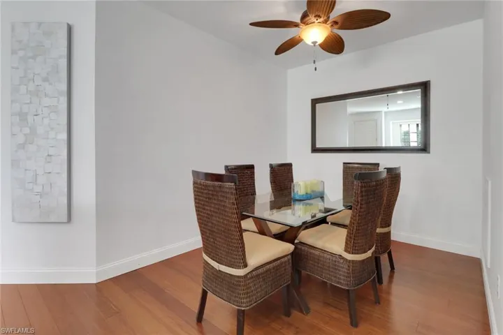 Dining area featuring wood-type flooring and ceiling fan