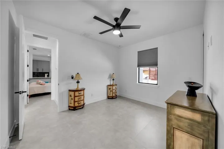 Bedroom featuring visible vents, baseboards, and ceiling fan