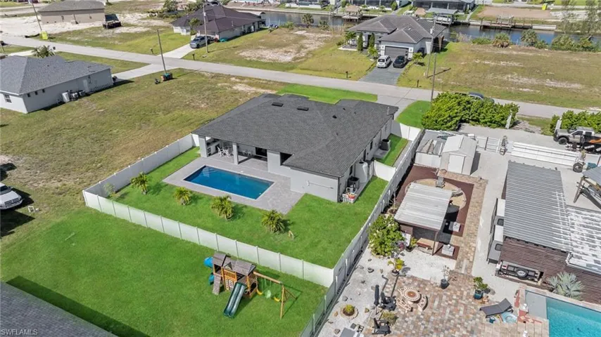 Bird's eye view featuring a water view and a residential view