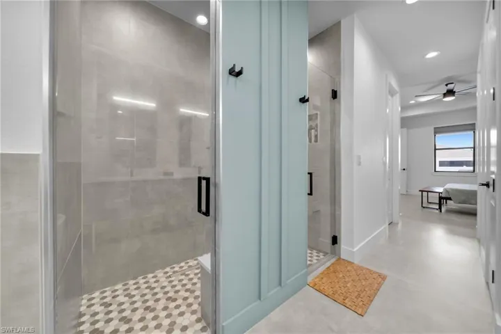 Ensuite bathroom with ensuite bath, ceiling fan, recessed lighting, and a stall shower