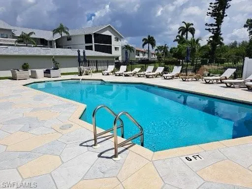 View of pool with new decking and furniture